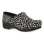 Clog, black and white polka dot, closed toe, thick sole, anti-fatigue rocker bottom. Dansko Pro on white background.