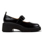 Shoe, black leather, by Camper. Chunky heel, buckle strap, grooved sole; modern silhouette. Comfort support features visible.