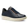 Shoe, navy blue ara Flora with dark laces, tan eyelets, removable insoles for comfort, and white rubber sole.