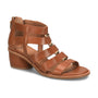 Sandal, brown leather, Sofft Coco with mid block heel, open toe, gold strap accents on white; cushioned footbed visible.