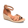 Sandal, tan espadrille wedge by Sofft with ankle strap, gold buckle, side view on white. Cushioned footbed visible.