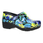 Clog by Dansko Xp 2.0, floral print, black sole, slip-resistant, with visible cushioned insole for comfort.