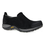 Shoe, black suede Dansko Pippy slip-on with gray Vibram outsole and visible stitching detail on white background.