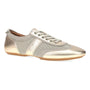 Sneaker, gold mesh Dansko Milana with stitching, flat brown sole; comfort footwear shown on white background.