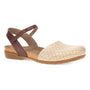 Sandal, beige leather, closed toe, perforated upper, brown ankle strap, flat rubber sole; Dansko Rowan comfort shoe.