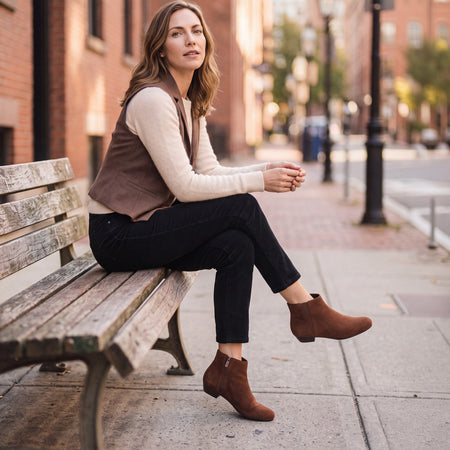 Model wearing Via Boot in color Dark Tan