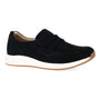 Shoe, black suede Dansko Clementine slip-on with white sole and tan outsole, side view on white background.