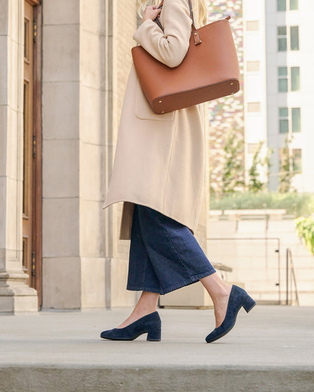 Model wearing Avenue Pump Metatarsal in color Navy Suede