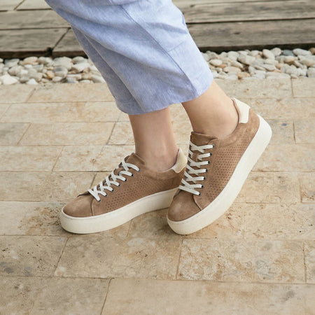 Model wearing Jumpstreet Sneaker Metatarsal in color Taupe Perforated