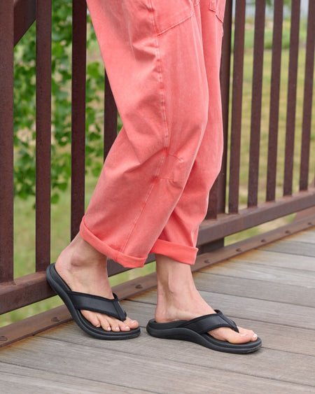 Model wearing Laguna Sandal Metatarsal in color Navy Nubuck