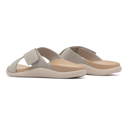 Model wearing Laguna Slide Metatarsal in color Beige Leather