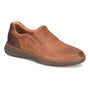 Slip-on shoe in brown perforated leather by Born Mackay with elastic panels and cushioned sole for comfort.