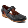 Shoe, black leather Cobb Hill Rully Mary Jane with floral cutouts, cushioned footbed, tan low sole, hook-and-loop strap.