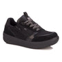 Athletic shoe by Drew Shoes, black suede, side zipper, thick cushioned sole for comfort.
