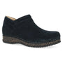 Bootie, black suede, Dansko Muriel with low wedge heel, visible stitching, cushioned cork midsole, side view.