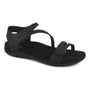 Sandal, black, by Strive Nice with open toe, ankle and toe straps, low heel, rubber sole, memory foam footbed.