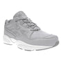 Shoe, Propet Stability Walker, gray leather with arch support, thick white sole, stitching, laces, 3/4 view.