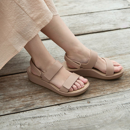 Model wearing Soleil Strap Metatarsal in color Taupe