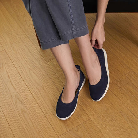 Model wearing Vela Ballet Metatarsal in color Navy