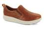 Slip-on shoe, brown premium leather with white sole, Strive Florida, shown side view on white background.