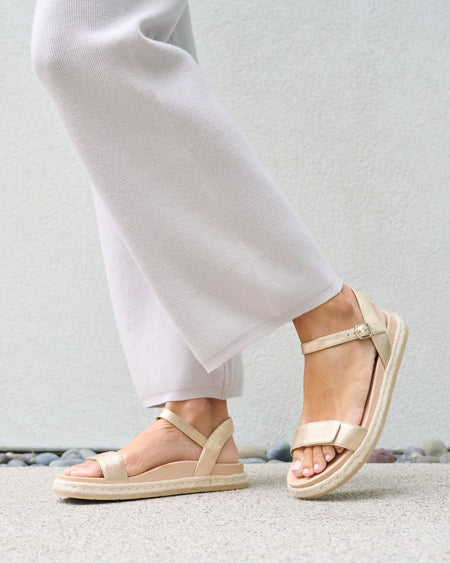 Model wearing Isle Strap in color Light Gold